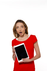 Young modern woman presenting a tablet  - isolated on white