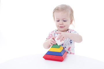 toddler girl stacking blocks