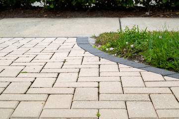 curved walkway with rectangular pavers