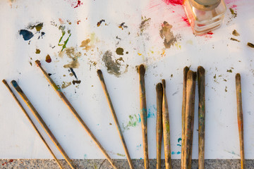 paint brushes, painted background
