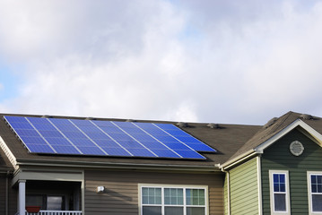 modern apartment and solar panels installed on roof