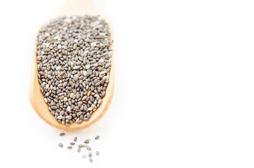 chia seeds in a wooden scoop.