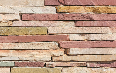 Surface wall of stone wall stones brown for use as background. The new design of modern stone wall. pattern of decorative stone wall surface.