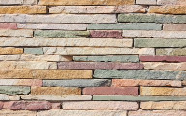 Surface wall of stone wall stones brown for use as background. The new design of modern stone wall. pattern of decorative stone wall surface.
