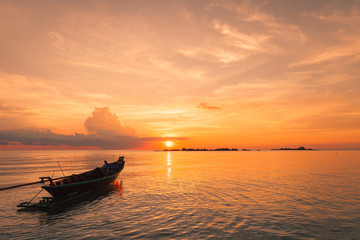 Naklejka premium Fisherman boat with sunset scene in koh phangan, Surat Thani, Th
