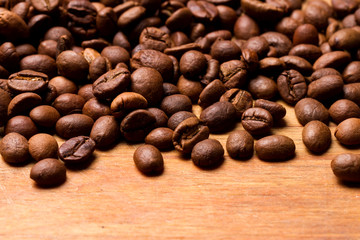 Coffee beans on wood background
