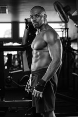 Fototapeta na wymiar Portrait of a handsome muscular bodybuilder with muscular torso