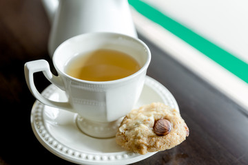 cup of tea with almond cookies