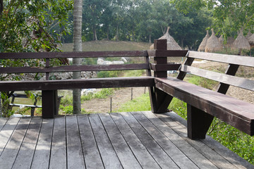 Naklejka premium wooden seat on the balcony