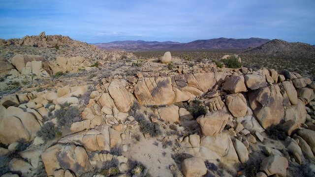 aerial of rock mountain in the California desert 