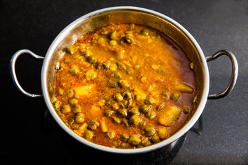 indian dish green gram with toamto curry and potatoes
