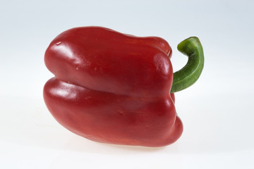 Red bell peppers isolated on white background.