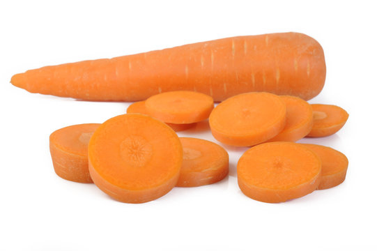Fresh sliced carrots on white