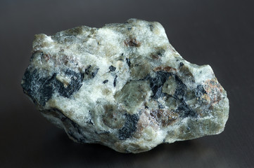 Mineral stone - apatite. Apatite is a group of phosphate minerals, usually referring to hydroxylapatite, fluorapatite and chlorapatite. Apatite  used by biological micro-environmental systems.