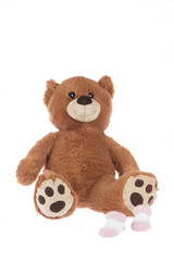 Teddy bear with pink socks, isolated