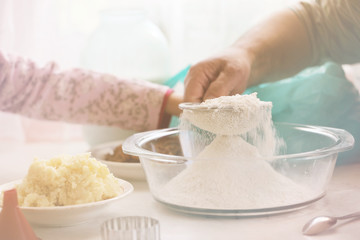 together sifted flour