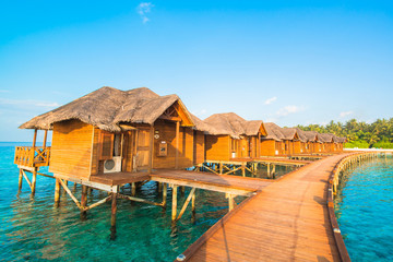 Over water bungalows with steps into amazing green lagoon 