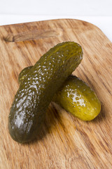 Pickled cucumbers on a kitchen cutting board