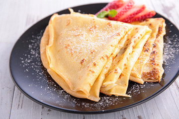 crepe with sugar and strawberry