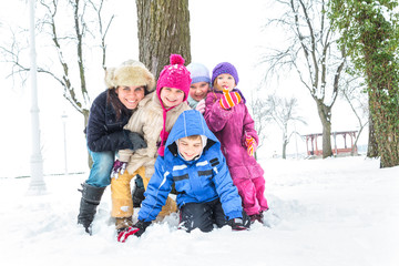 Happy family enjoying in winter