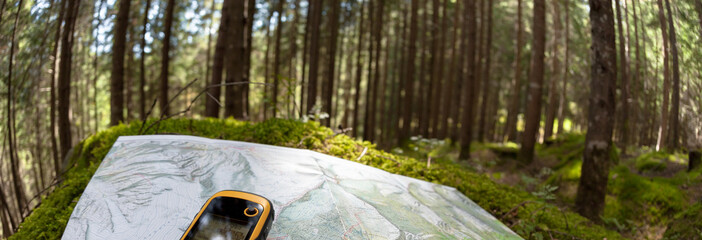 finding the right position in the forest via gps - obrazy, fototapety, plakaty