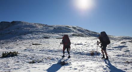 Two girls with backpacks.