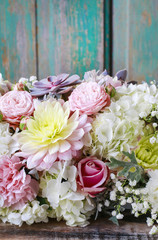 Romantic flower background with roses, dahlias and hortensias