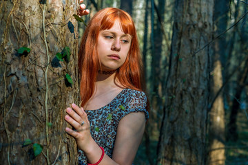 redhead girl in the forest