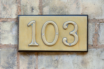 House number 103 sign