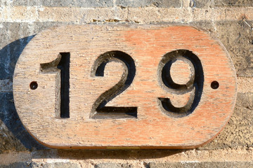 House number 129 sign