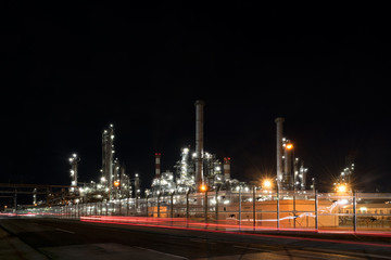 Fototapeta na wymiar Oil refinery plant of petroleum or petrochemical industry production at night