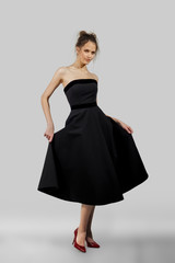 Naklejka premium young lady posing in fashion dress