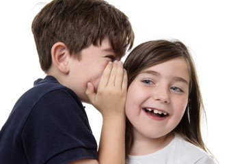 children sharing a secret