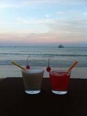 Two glasses of cocktail at beach