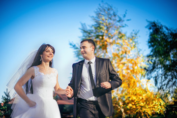 Beautiful bride running look at each other