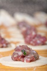 Pelmeni - Russian ravioli. Cooking process. Selective focus