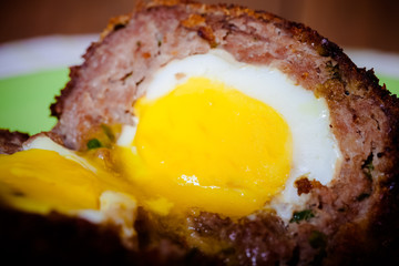 Fried cutlet  with egg inside served on a plate. Selective focus