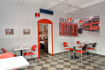 Interior of modern cafe in red and light tones. Stylization unde