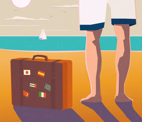 bare legs and suitcase on a beach