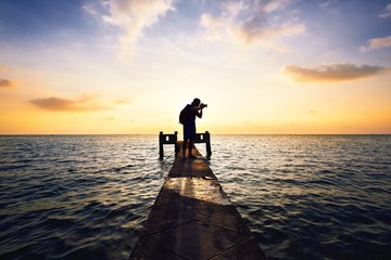 Fototapeta premium Photographer at the sunset