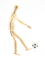Wooden puppet playing football
