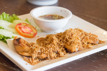 plate of chicken wings on wooden table