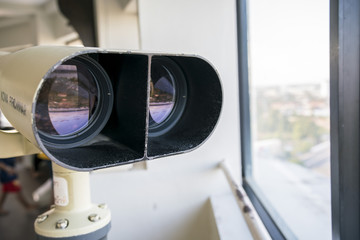 Binocular looking out of the window. - binocular for viewing