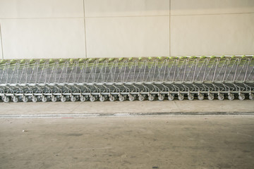 Shopping carts in a shopping mall basement parking - Shopping carts on a parking lot
