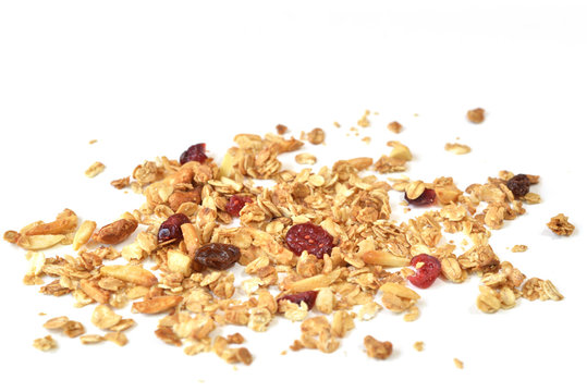 Granola with honey, oatmeal, cashew nut, almond, raisin and cranberry on white background