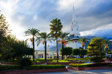 Kemer city central tower square with big clock and cafe. And city park. Antalya. Turkey. Lovely place of tourists