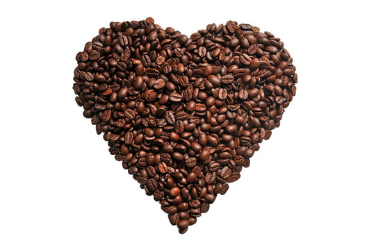 Coffee grains in the shape of a heart on a white background