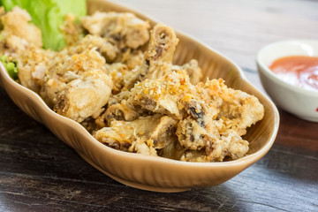 plate of chicken wings on wooden table