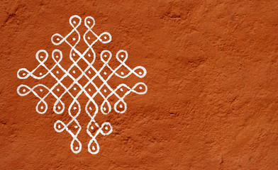 Closeup of Rangoli on the wall of House a hindu tradition in india