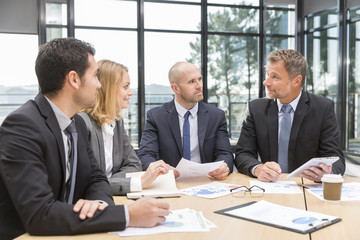 Group of business people having meeting in office